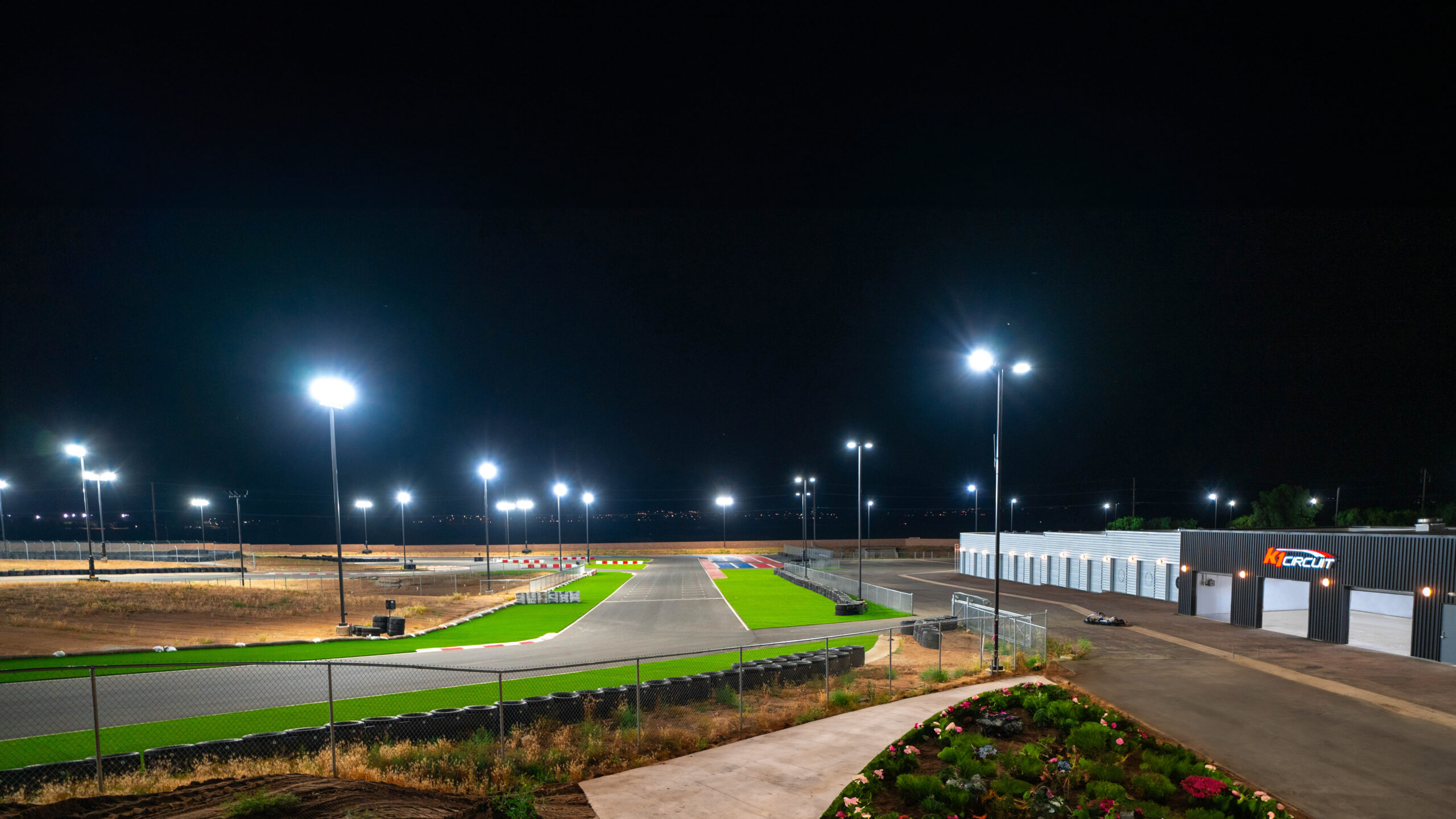 the main straight at k1 circuit at night with lights