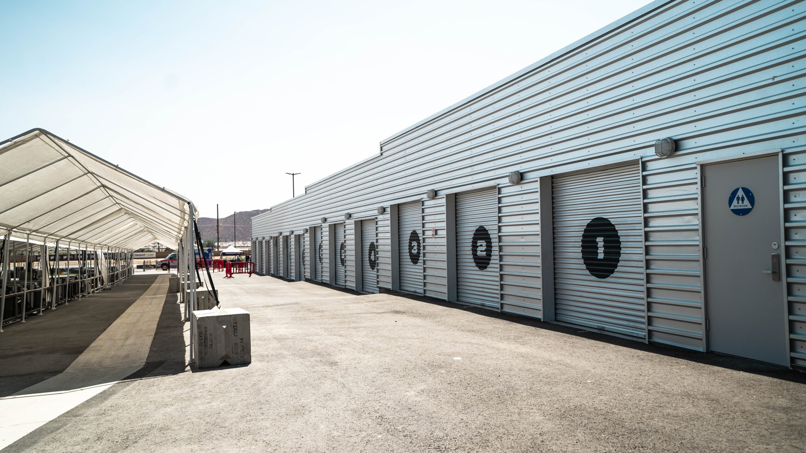 garages line the track at k1 circuit