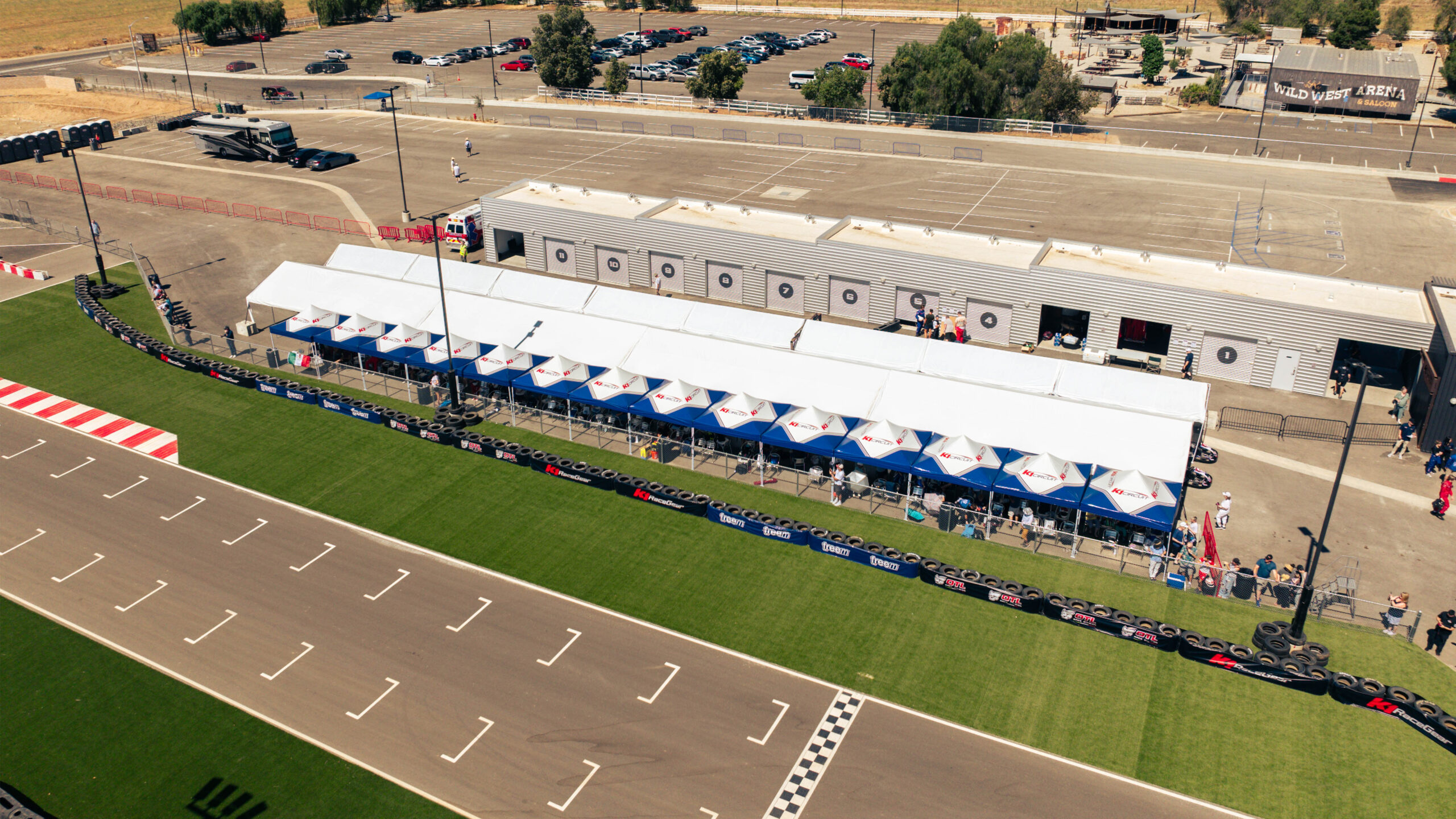 aerial shot of k1 circuit's main straight with canopies lined up