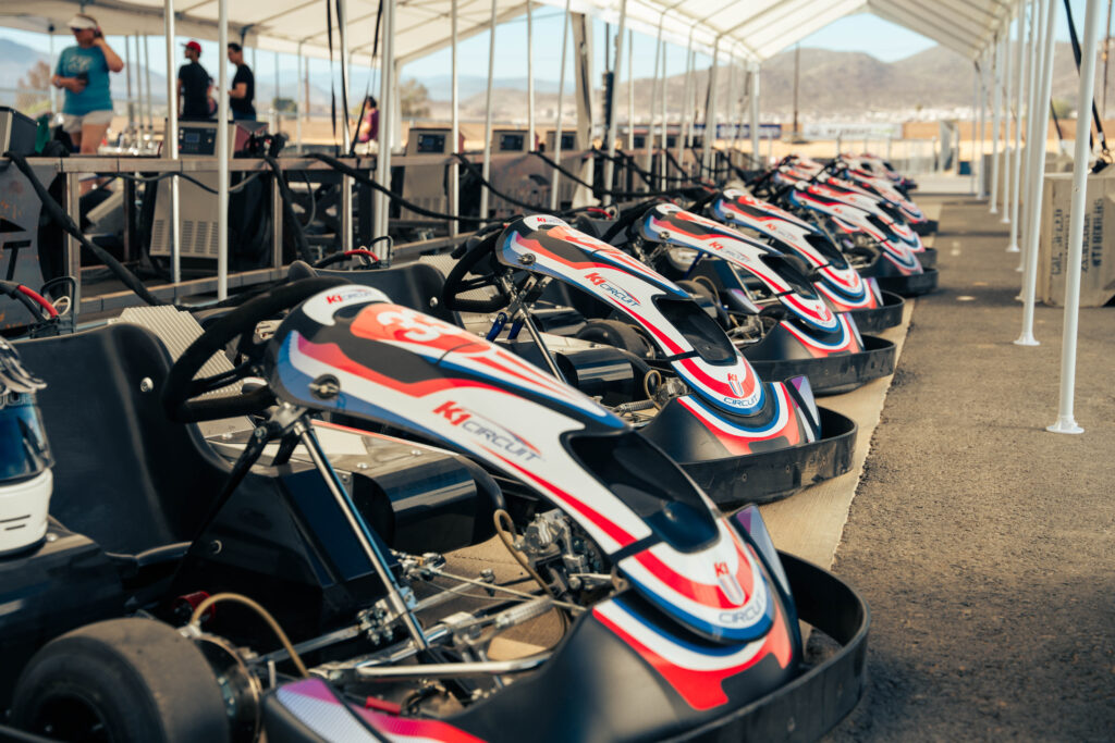 karts lined up in the pits at k1 circuit