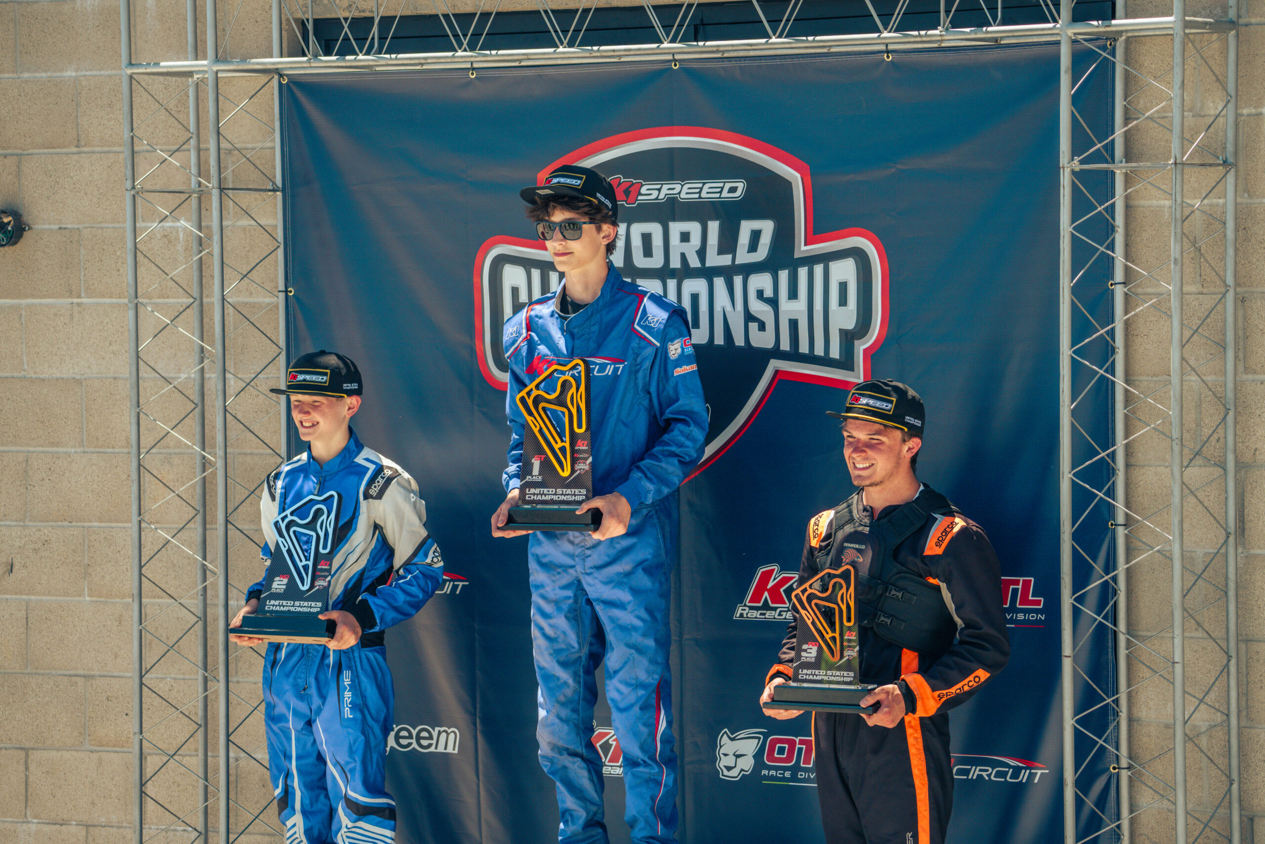 racers stand on the podium at k1 circuit