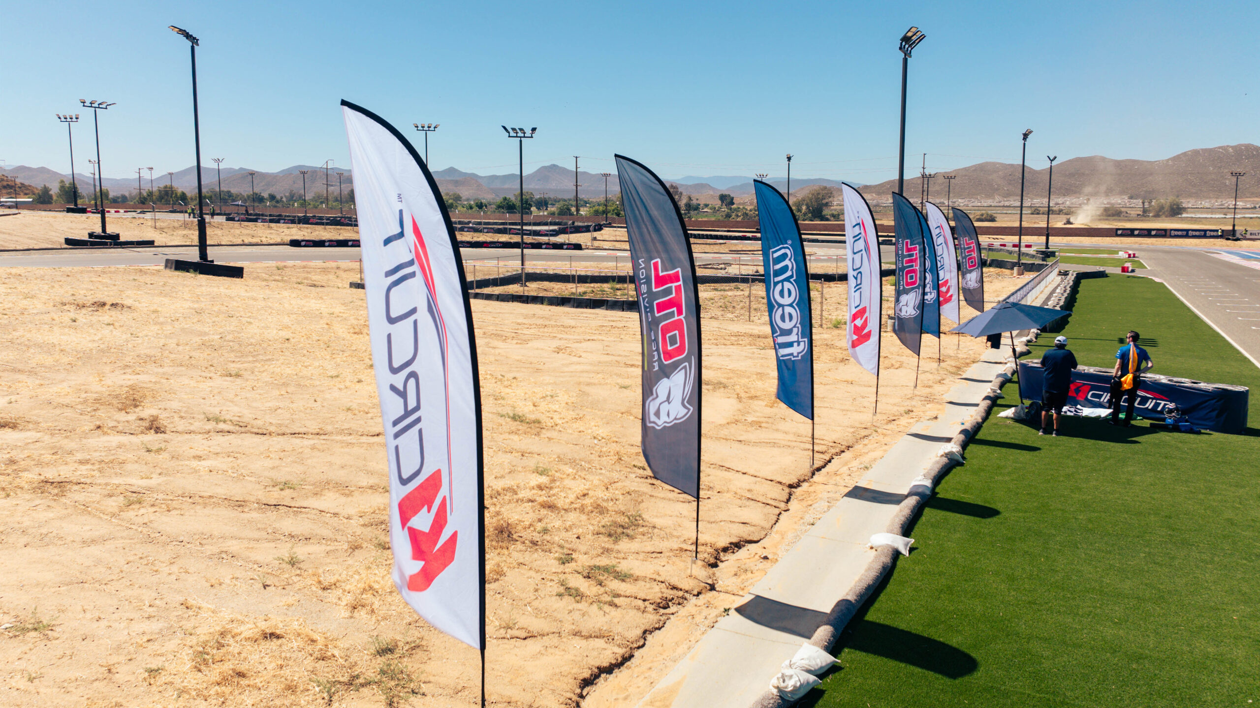 promotional feather flags line the main straight at k1 circuit